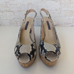 Stuart Weitzman Jean slingback wedge sandals in a snake-embossed leather finish